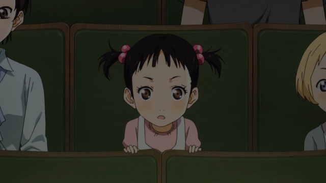 Igawa quando criança assistindo uma apresentação de Kousei